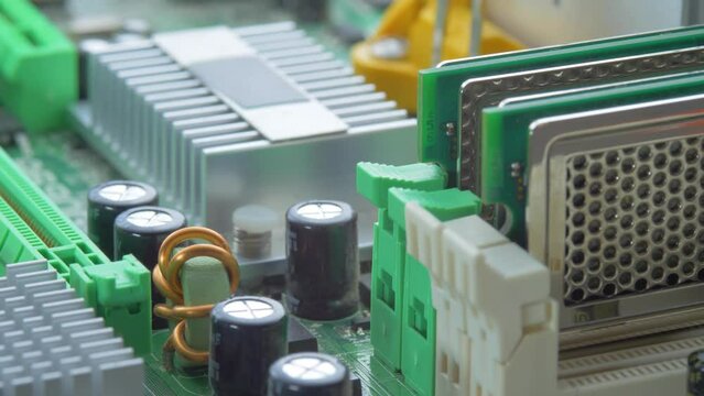 Printed circuit board with many electrical components. Computer hardware technology concept. Random Access Memory abbreviated as DDR RAM