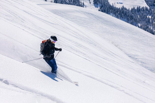 Skier skiing on snowy mountain