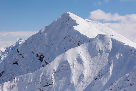 Snowcapped mountain on sunny day