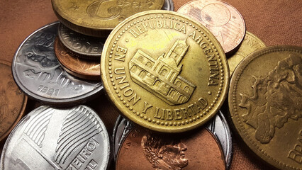 Golden Peso coin, with the image of the Cabildo of Buenos Aires building, together with a...