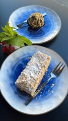 Napoleon cake and chocolate on the table