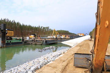 Fototapeta na wymiar May 01 2022 - Oder-Havel Wasserstrasse, Brandenburg, Germany: construction work on the canal