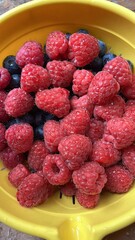 raspberries and blueberries on a plate