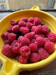 raspberries and blueberries on a plate