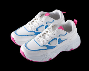 New white sneakers isolated on black background. Fashionable sports shoes. Clean stylish sport...
