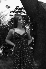 Fototapeta premium Young woman in dress in the park