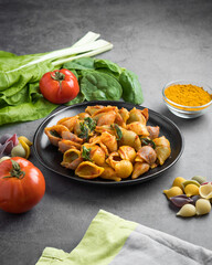 Italian macaroni homemade recipe surrounded of ingredients 