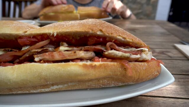 Close up of a big sandwich in the restaurant.