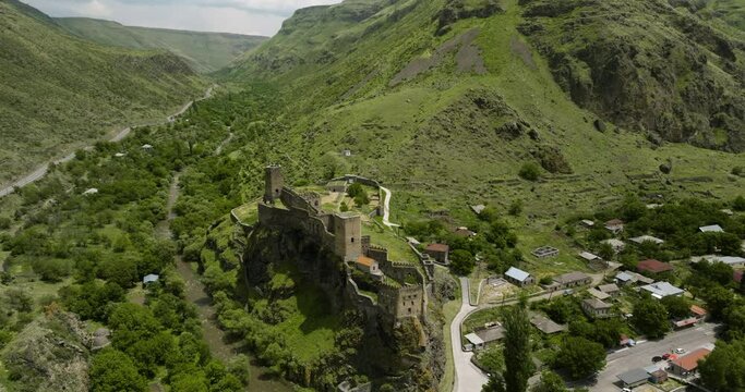 The Great Caucasus Mountains With Georgian Khertvisi Fortress Ruins Near Khertvisi Village Of Aspindza Municipality, Southern Georgia. Aerial Drone Shot