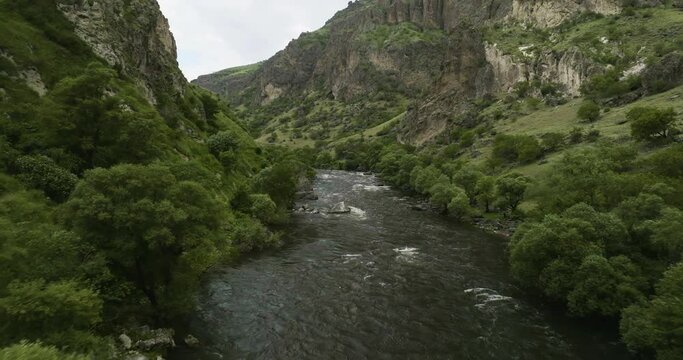 Paravani Estuary Flowing In Rocky Steep Caucasus Mountains Near Khertvisi In Aspindza Municipality, Southern Georgia. Aerial Drone Shot