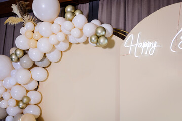 Photo zone with arch, balloons, flowers on birthday party