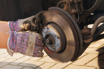 Repair of a wheel on a passenger car. Wheel balancing or repair. Car repair concept..