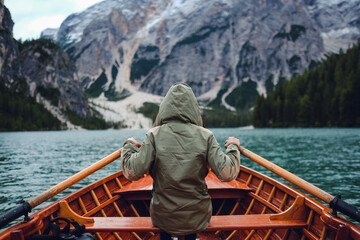 Rowing a boat at Lago di Braies, South Tyrol, Italy.