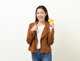 Portrait beautiful asian women in jacket fashion jean standing pose holding credit card to shopping...