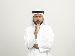 Portrait of arabic man with kandura dress on isolated white background. Arab business people...