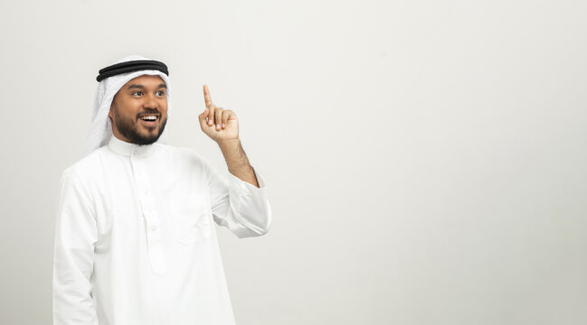 Portrait Of Arabic Man With Kandura Dress On Isolated White Background. Arab Business People Thinking.