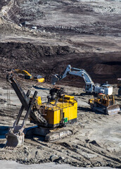 Panoramic aerial view of coal mine. Open pit mine industry, big yellow mining truck for coal...