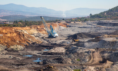 Panoramic aerial view of coal mine. Open pit mine industry, big yellow mining truck for coal...
