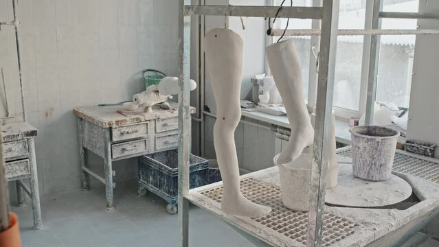 Horizontal no people shot of human leg plaster casts prepared for further work in prosthetic production workshop