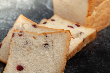 Resin bread loaf on cement color background.
