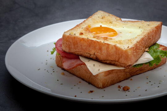 Sandwich Egg Toast with cheese on a dish.