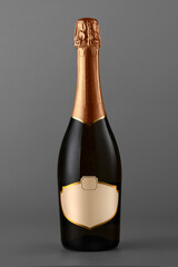 Champagne bottle isolated on gray background, close-up