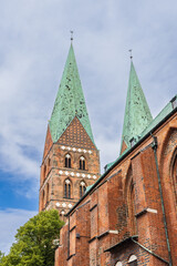 Fototapeta na wymiar Lubeck, Germany - July 30, 2022: Ancient Lubeck cathedral with two towers in Schleswig-Holstein in northern Germany