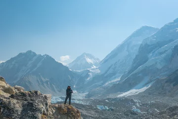 Papier Peint photo Ama Dablam Male backpacker enjoying the view on mountain walk in Himalayas. Everest Base Camp trail route, Nepal trekking, Himalaya tourism.