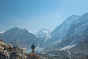 Photo sur Aluminium brossé Ama Dablam Male backpacker enjoying the view on mountain walk in Himalayas. Everest Base Camp trail route, Nepal trekking, Himalaya tourism.