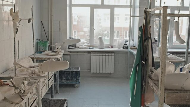 No people shot of modern prosthetic production workshop room interior with various tools and plaster casts