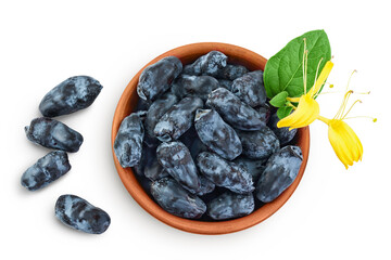 Fresh honeysuckle blue berry in ceramic bowl isolated on white background with full depth of field. Top view. Flat lay