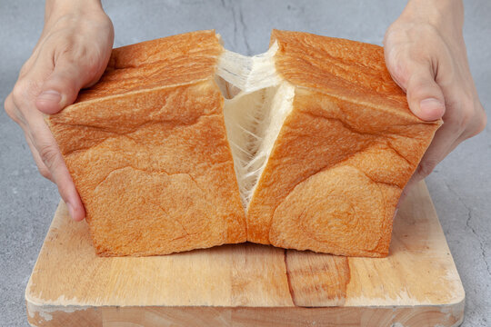 NAMA Shokupan or Japanese bread loaf on wooden board.