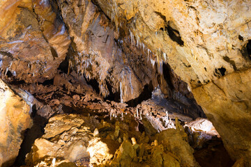 Inside of beautiful old dark cave with many stalactites. Grotte di Is Zuddas, Italy, Sardinia