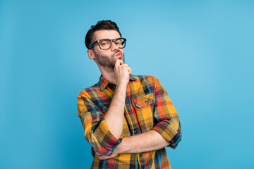 Photo of smart thoughtful boss dressed checkered shirt glasses arm on chin thinking about startup...