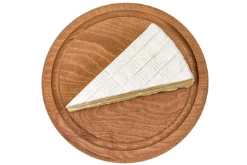 Brie cheese triangle on wooden board on white