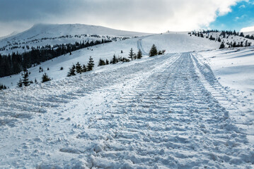 Track of caterpillar snowcat in mountains