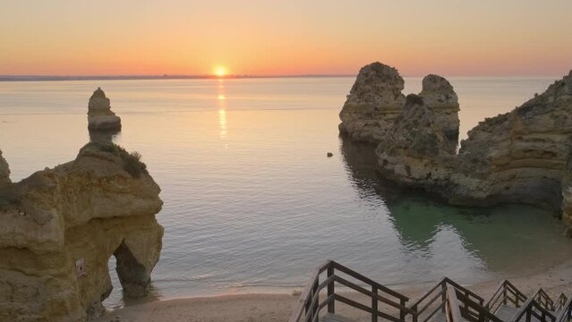 Praia do Camilo beach at sunrise near Lagos town, Algarve province, Portugal