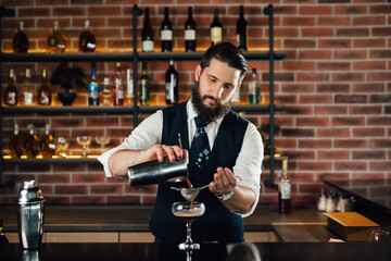 barman preparing cocktail in bar