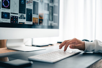 Man working on computer desk at home office