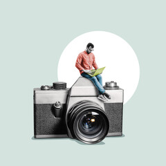 A man with a laptop is sitting on the photo camera.