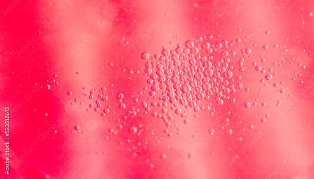 Aufkleber abstract red liquid with bubbles and a single larger droplet, creating a unique texture and color co