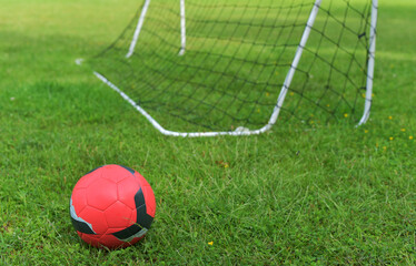 Soccer ball near the gate.