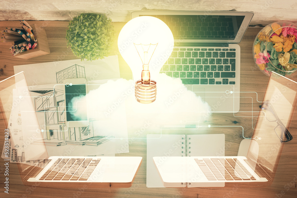 Aufkleber bulb drawing over computer on the desktop background. top view. double exposure. idea concept.