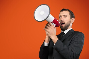Young man hold scream in megaphone announces discounts sale