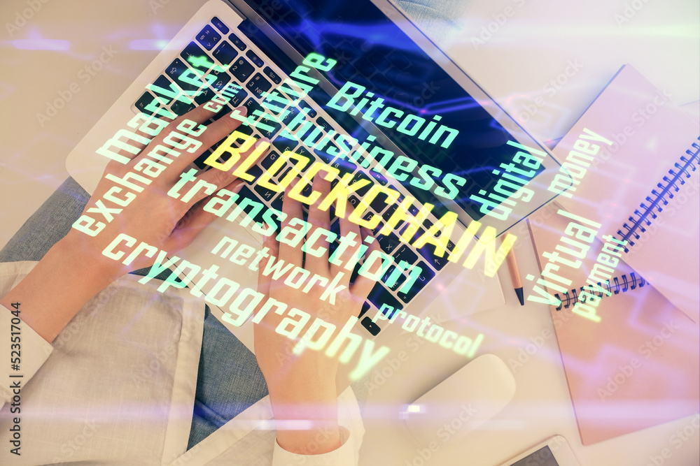 Poster double exposure of woman hands working on computer and blockchain theme hologram drawing. top view. 