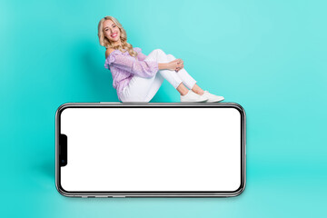 Photo of funny adorable lady wear violet blouse sitting modern device empty space isolated turquoise color background