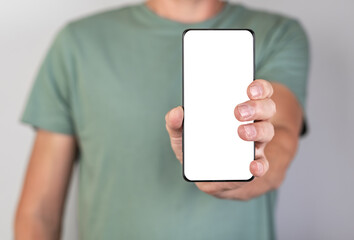 Man holding phone mockup in vertical position. Android with blank display. Person stretching...