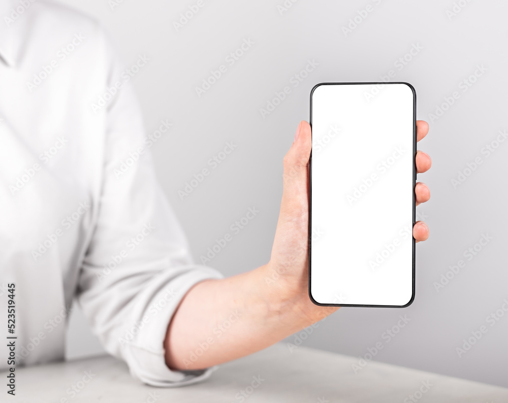 Poster woman holding phone mockup in vertical position. telephone template with empty screen for advertisin