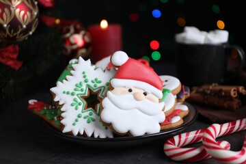 Bright delicious Christmas cookies on black table