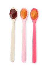 Spoons of tasty pureed baby food isolated on white, top view